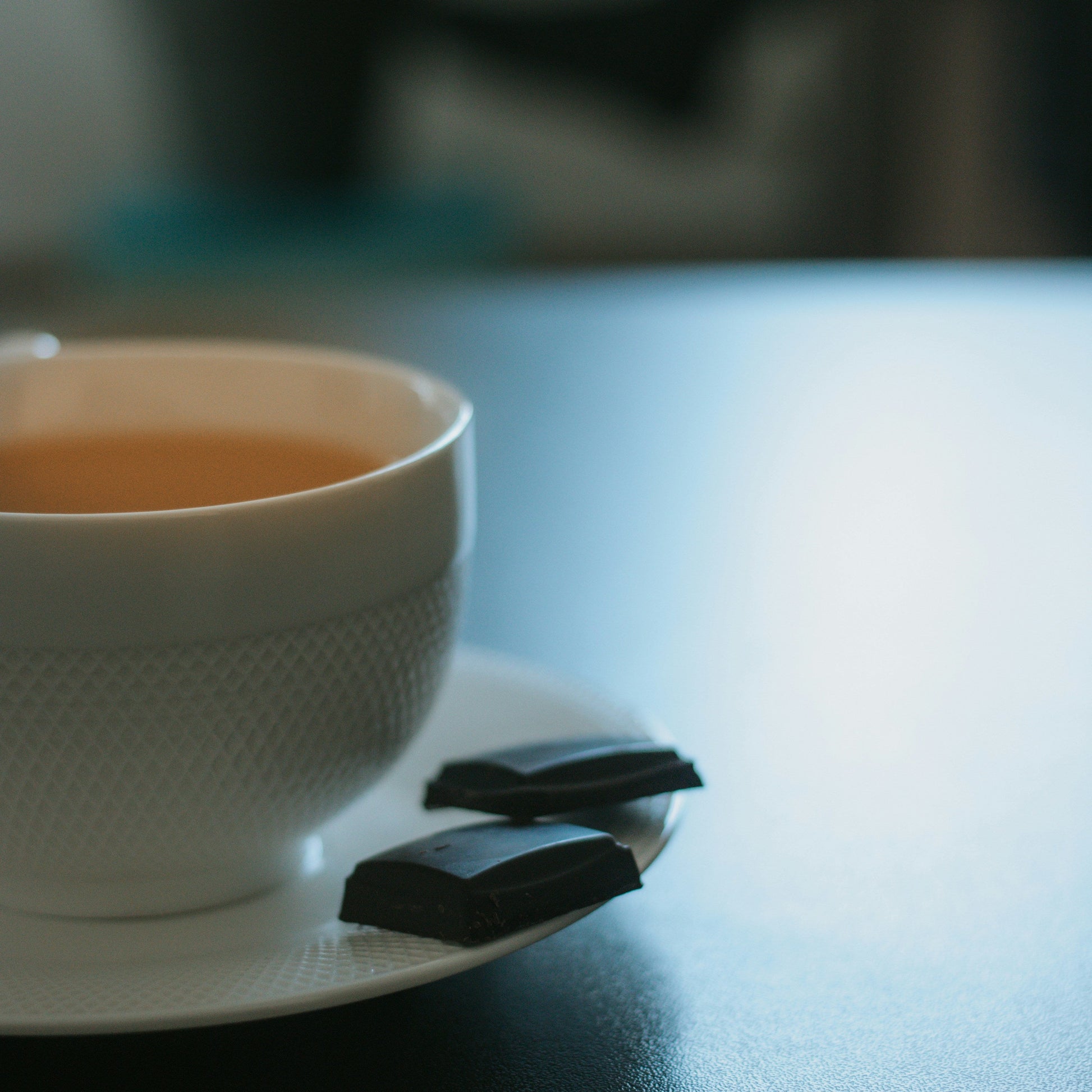 The Serenity Ensemble: White ceramic teapot with signature white tea tins for an afternoon ritual. | Cove Tea Co