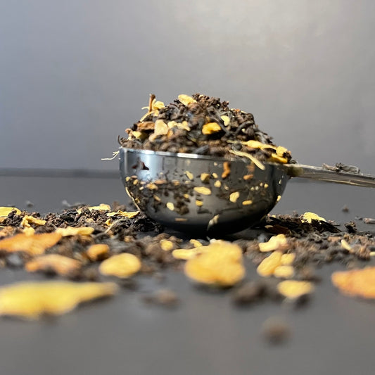 Loose Masala Chai Sitting in a Perfect Teaspoon with a black backdrop | The Cove Tea Company | Spruce Grove AB Canada